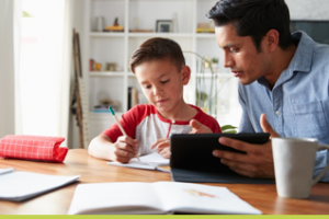 Parent helping child with Maths and English