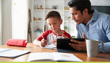 Parent helping child with Maths and English